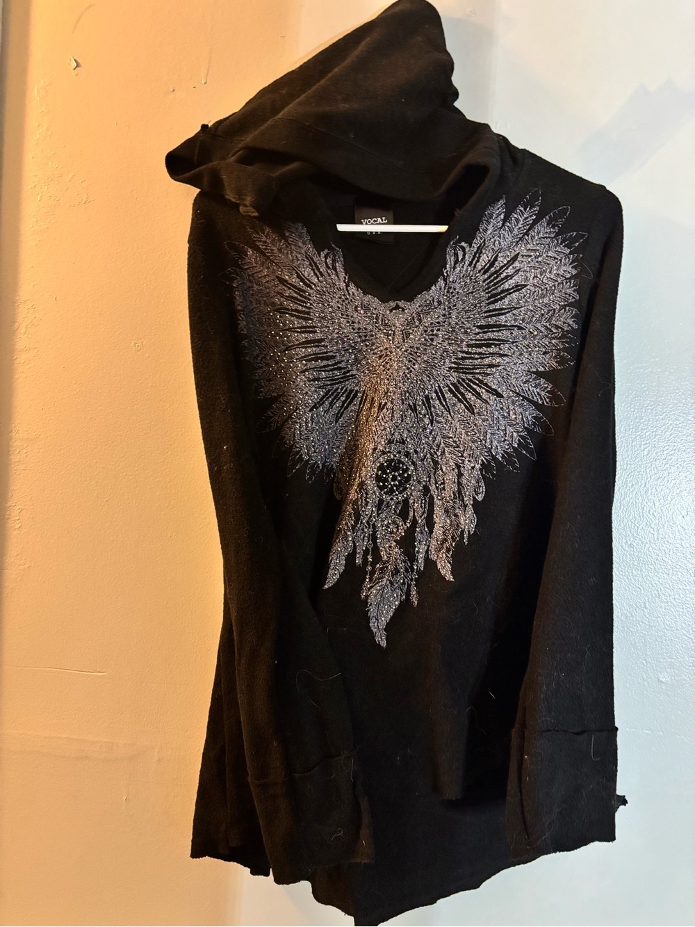 Vocal Black Hoodie with Metallic Silver Wing Graphic